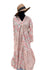 Peach block print dress with alternate pateches of a small green print