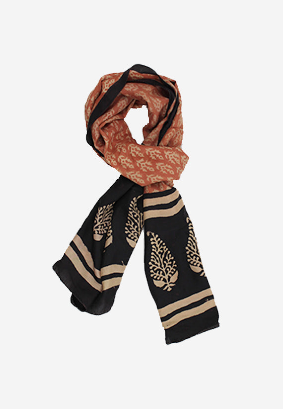 Unique hand block floral print silk scarf in rust with a black floral border made with natural dyes.