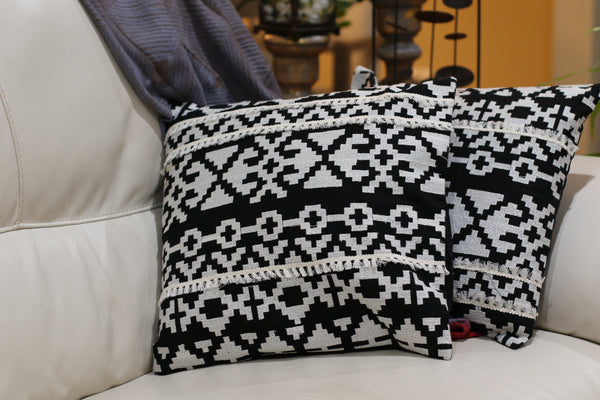 Set of handmade pillow covers in black and white with thread work