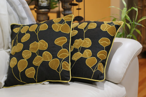 Set of handmade pillow in black base with yellow applique floral pattern