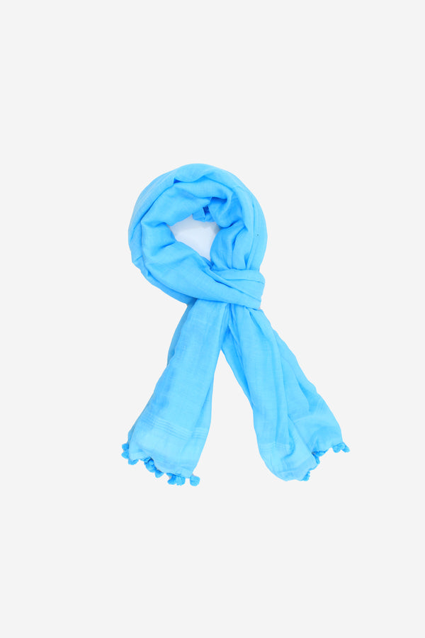 Soft handspun cotton scarf in bright blue with hand tied pompom tassels