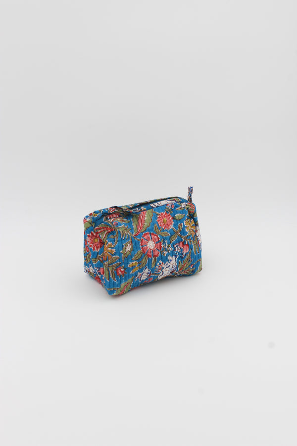 Cotton hand-block wash bag with two inside pockets in blue and pink floral print.