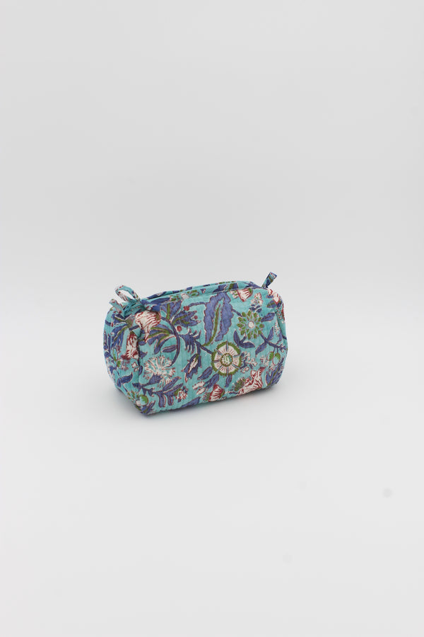 Cotton hand-block wash bag with two inside pockets with light blue base and floral print.