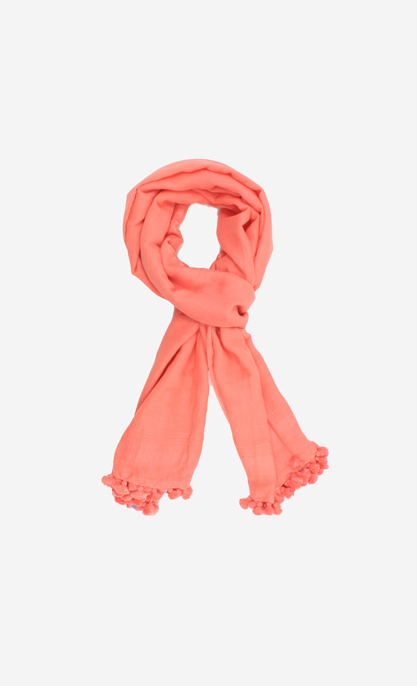 Soft handspun cotton scarf in peach pink with hand tied pompom tassels.